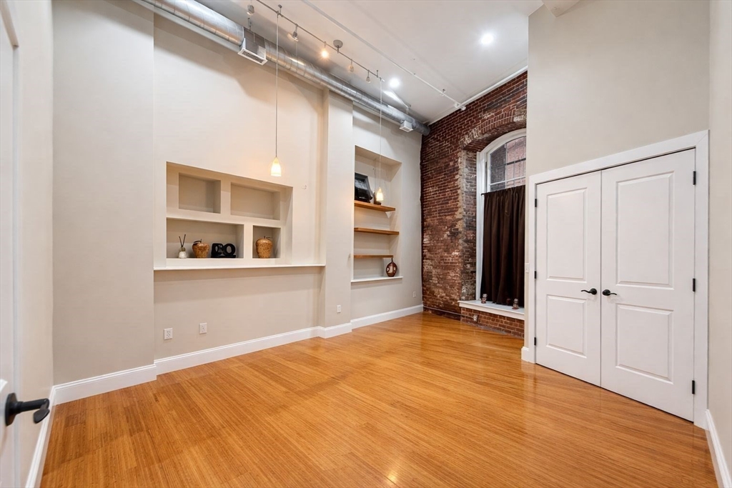 30 Market Street, Unit 7 Lowell, MA 01852 - Photo 6 of 11 a view of an empty room with closet and a window