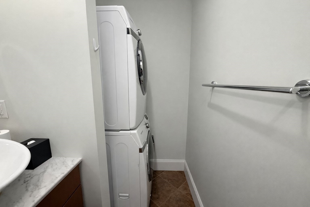 30 Market Street, Unit 7 Lowell, MA 01852 - Photo 10 of 11 a bathroom with a granite countertop shower and a sink