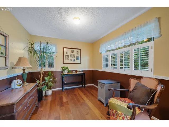 a bathroom with a sink a toilet a mirror and shower