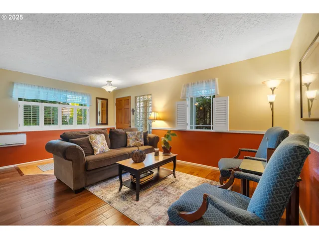 a bedroom with a large bed and a dresser