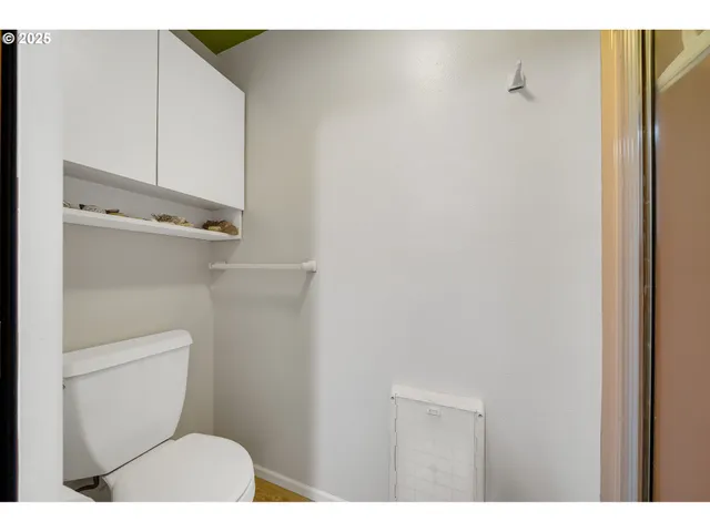 a view of a room with furniture and wooden floor
