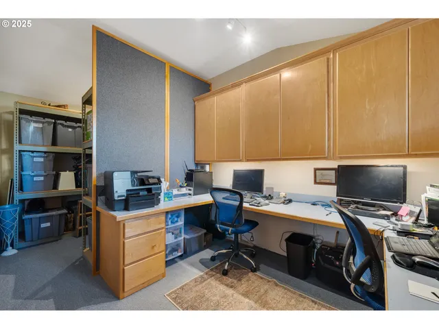 a bathroom with a sink mirror and a shower