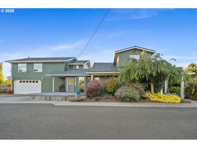 a view of a patio with table and chairs and potted plants