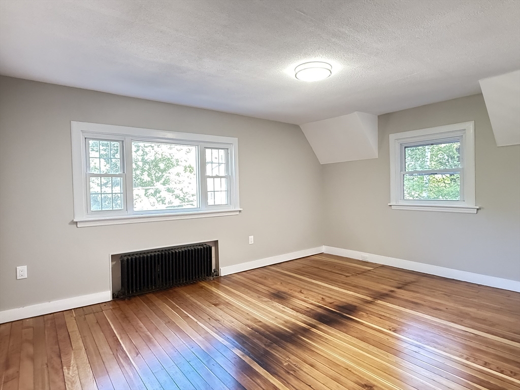 37 Bridge Street Monson, MA 01057 - Photo 12 of 35 a view of empty room with wooden floor and fan
