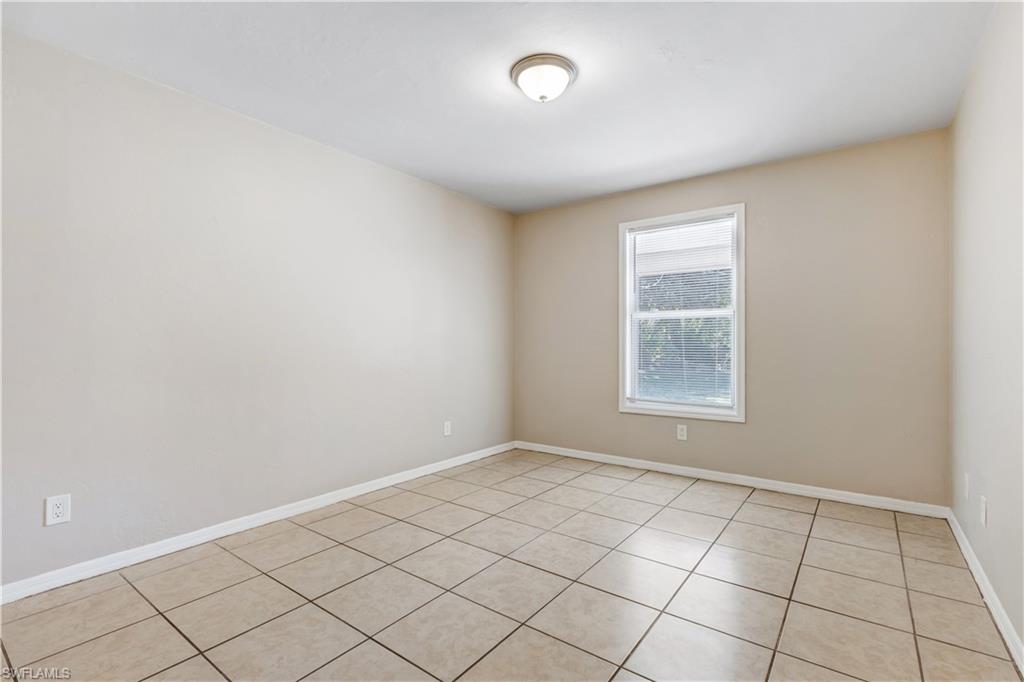 5453 16th Place Southwest Naples, FL 34116 - Photo 13 of 36 an empty room with windows