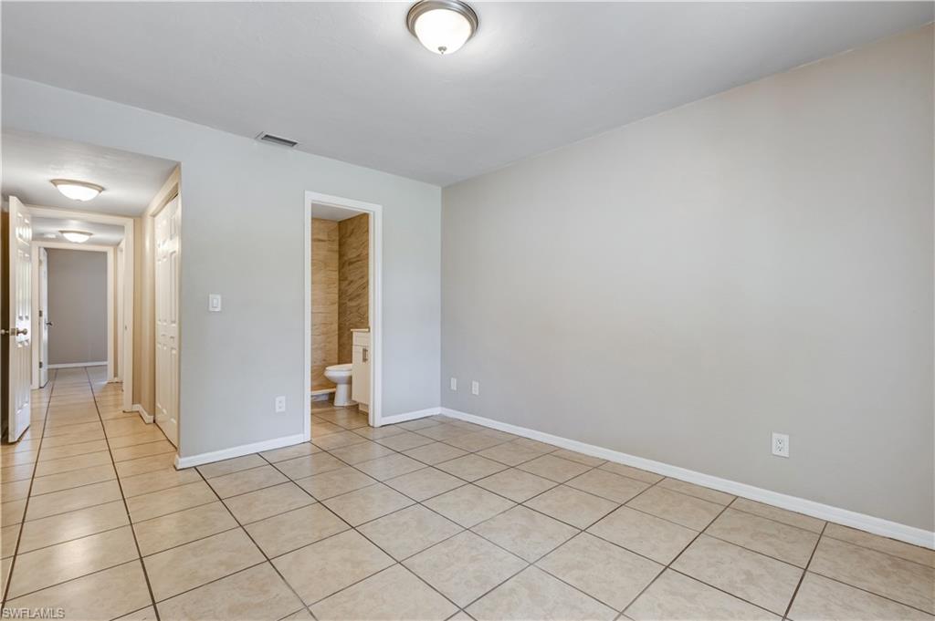 5453 16th Place Southwest Naples, FL 34116 - Photo 14 of 36 a view of an empty room and window