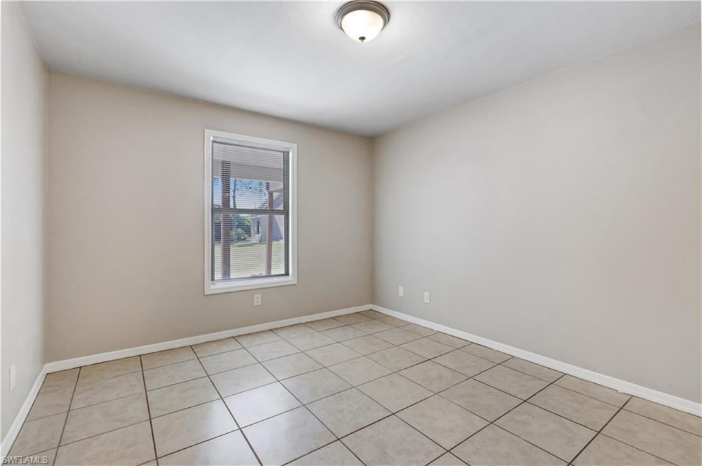 5453 16th Place Southwest Naples, FL 34116 - Photo 19 of 36 a view of an empty room and window