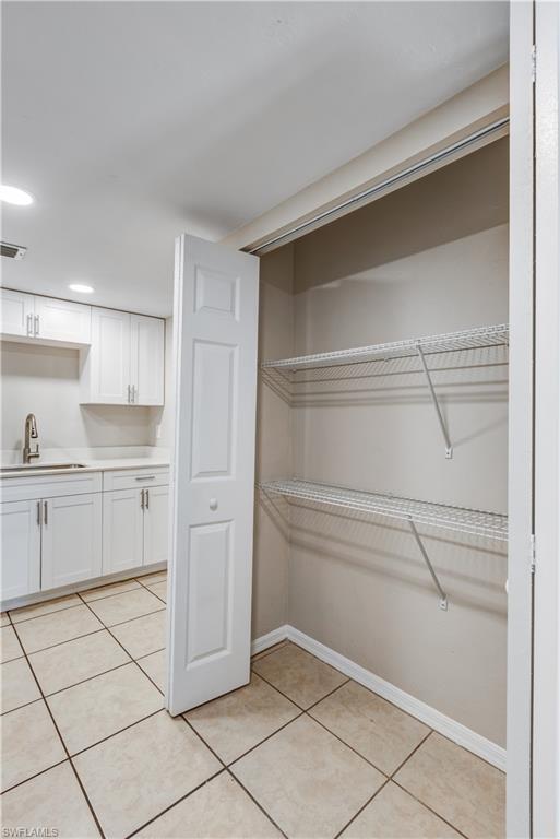 5453 16th Place Southwest Naples, FL 34116 - Photo 24 of 36 a view of cabinets and window