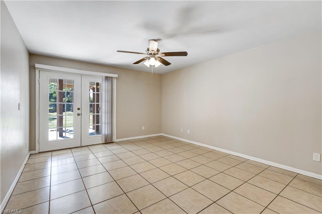 5453 16th Place Southwest Naples, FL 34116 - Photo 25 of 36 wooden floor in an empty room with a window