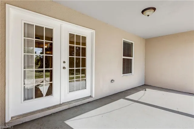 a view of empty room with windows