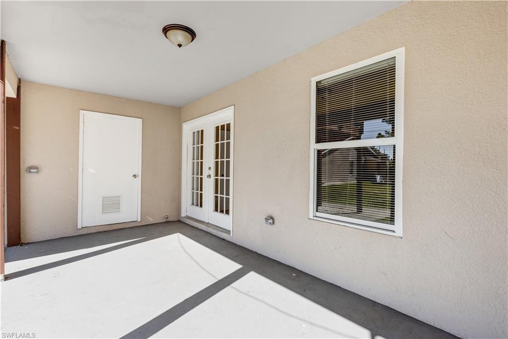 5453 16th Place Southwest Naples, FL 34116 - Photo 32 of 36 an empty room with windows