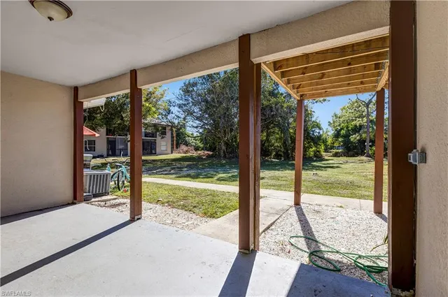 a view of a room with yard from a window