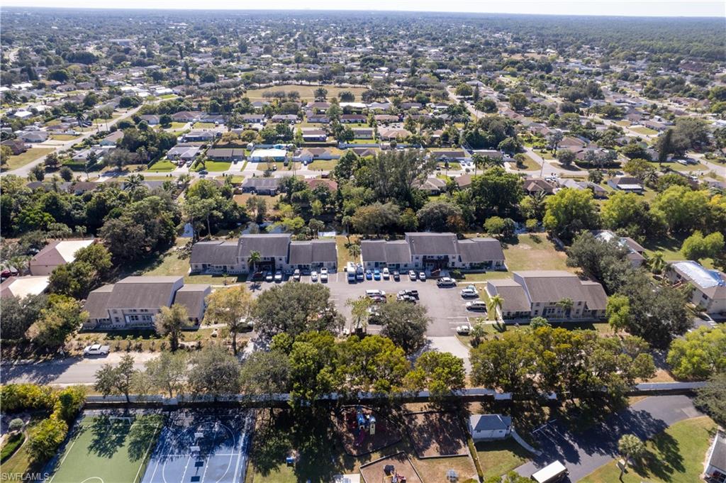 5453 16th Place Southwest Naples, FL 34116 - Photo 36 of 36 an aerial view of a city with lots of residential buildings