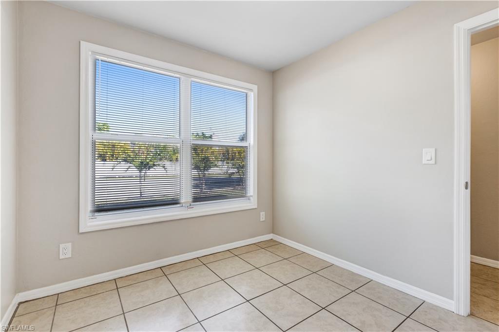 5453 16th Place Southwest Naples, FL 34116 - Photo 8 of 36 a view of an empty room with a window