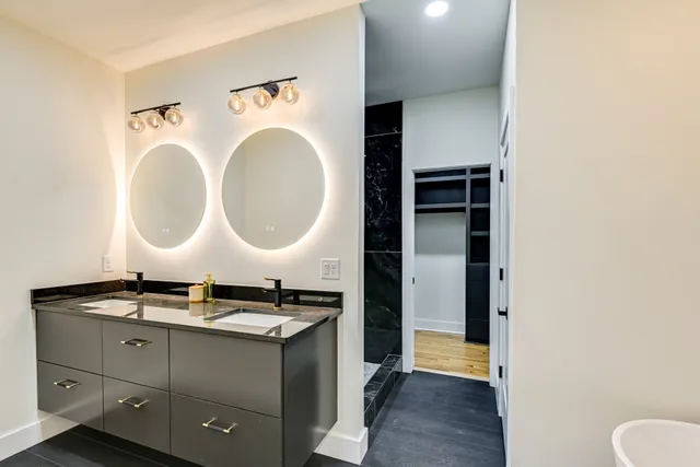 a bathroom with a bathtub and shower