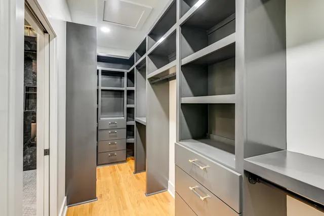 a bedroom with bed couch and window