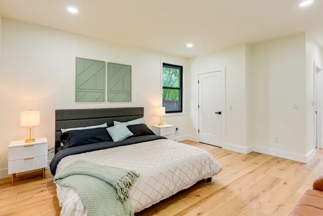 a bathroom with a sink toilet and a mirror