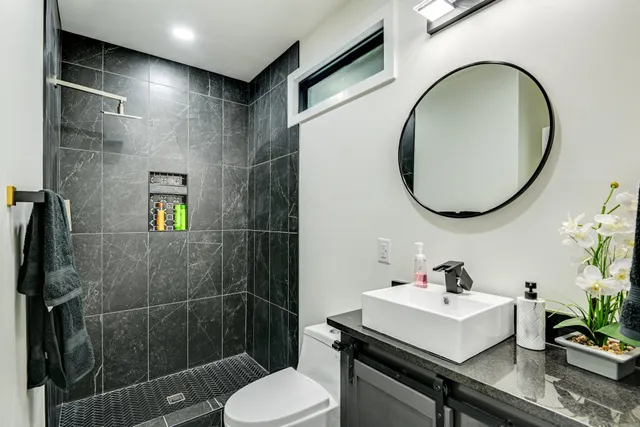 a bedroom with bed and wooden floor