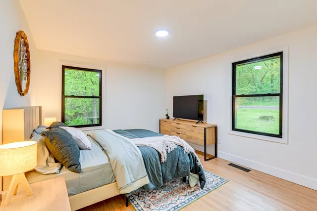 a bathroom with a sink toilet and a mirror