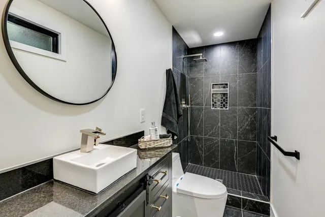 a bedroom with furniture and a window