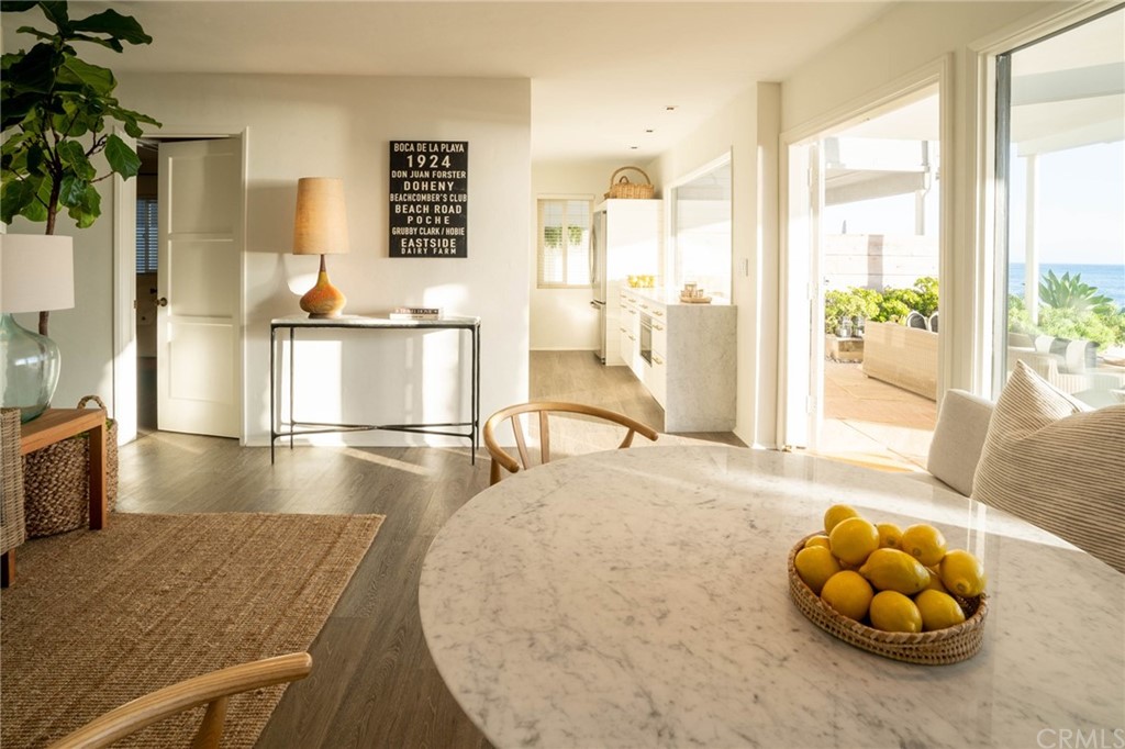 35581 Beach Road Dana Point, CA 92624 - Photo 2 of 23 a view of a livingroom with furniture and floor to ceiling window
