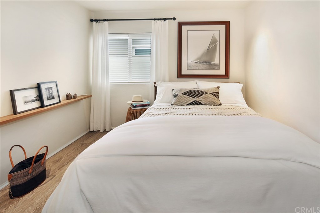 35581 Beach Road Dana Point, CA 92624 - Photo 11 of 23 a bedroom with a bed and a painting on the wall