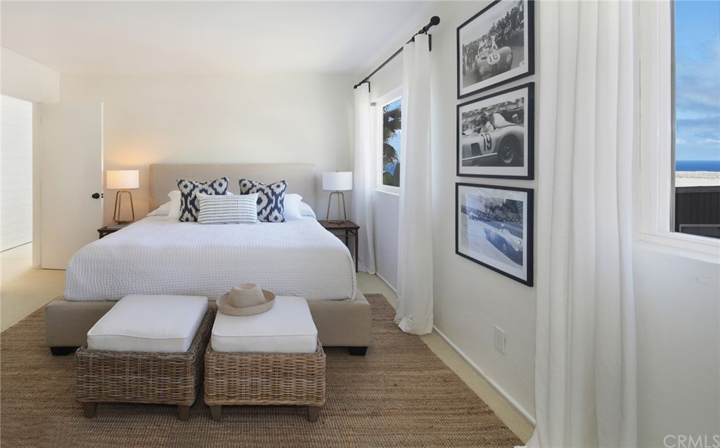 35581 Beach Road Dana Point, CA 92624 - Photo 16 of 23 a bedroom with a bed and a painting on the wall