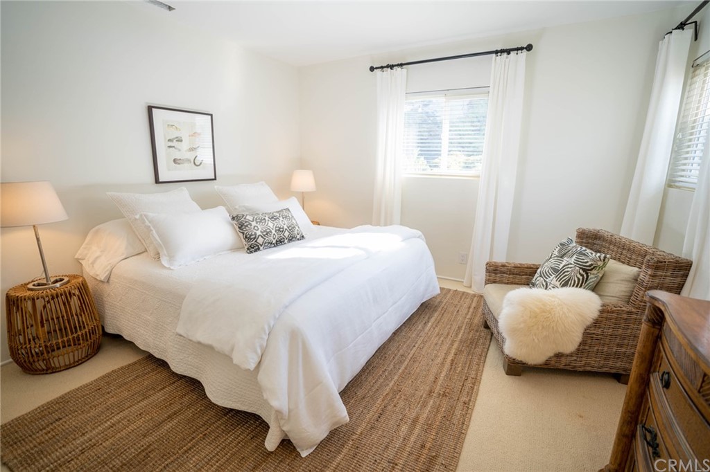35581 Beach Road Dana Point, CA 92624 - Photo 17 of 23 a bedroom with bed and a window