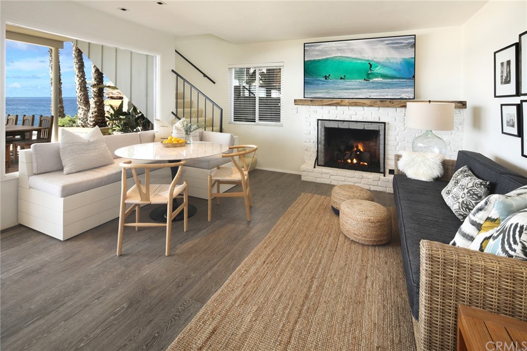 35581 Beach Road Dana Point, CA 92624 - Photo 4 of 23 a living room with furniture and a fireplace