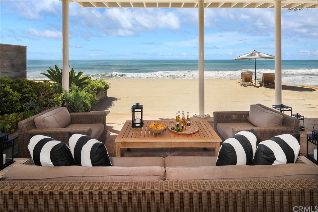 35581 Beach Road Dana Point, CA 92624 - Photo 8 of 23 a living room with furniture and a floor to ceiling window