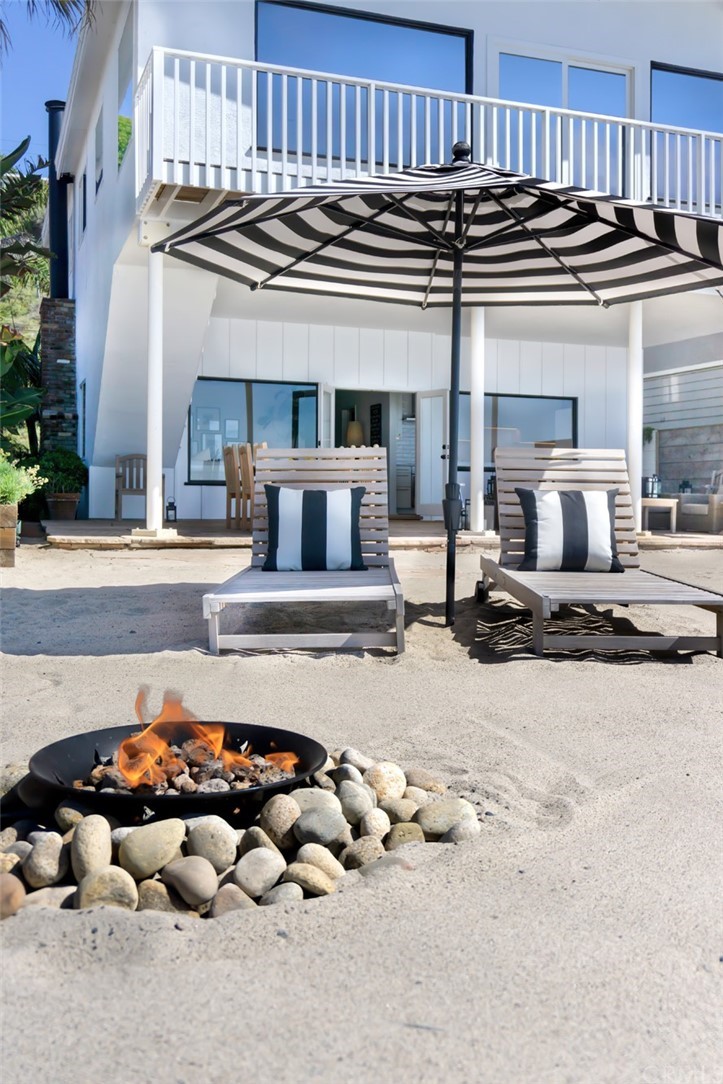 35581 Beach Road Dana Point, CA 92624 - Photo 10 of 23 a kitchen with a stove a table and chairs