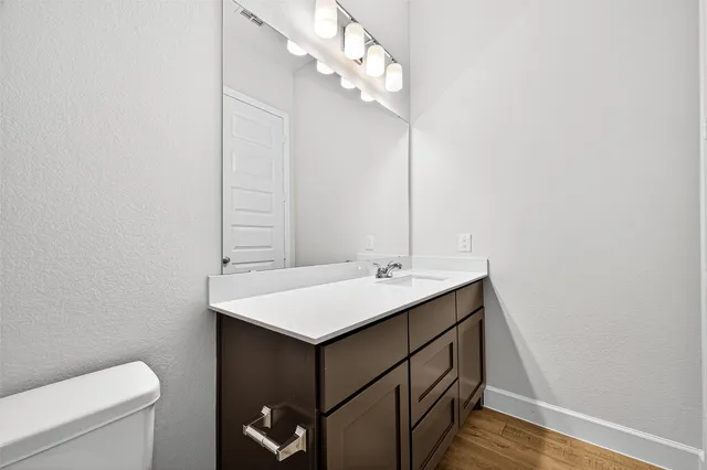 a view of a small space with wooden floor