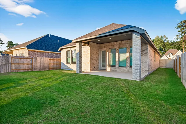 a view of house with yard