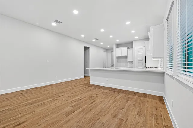 a view of kitchen with wooden floor