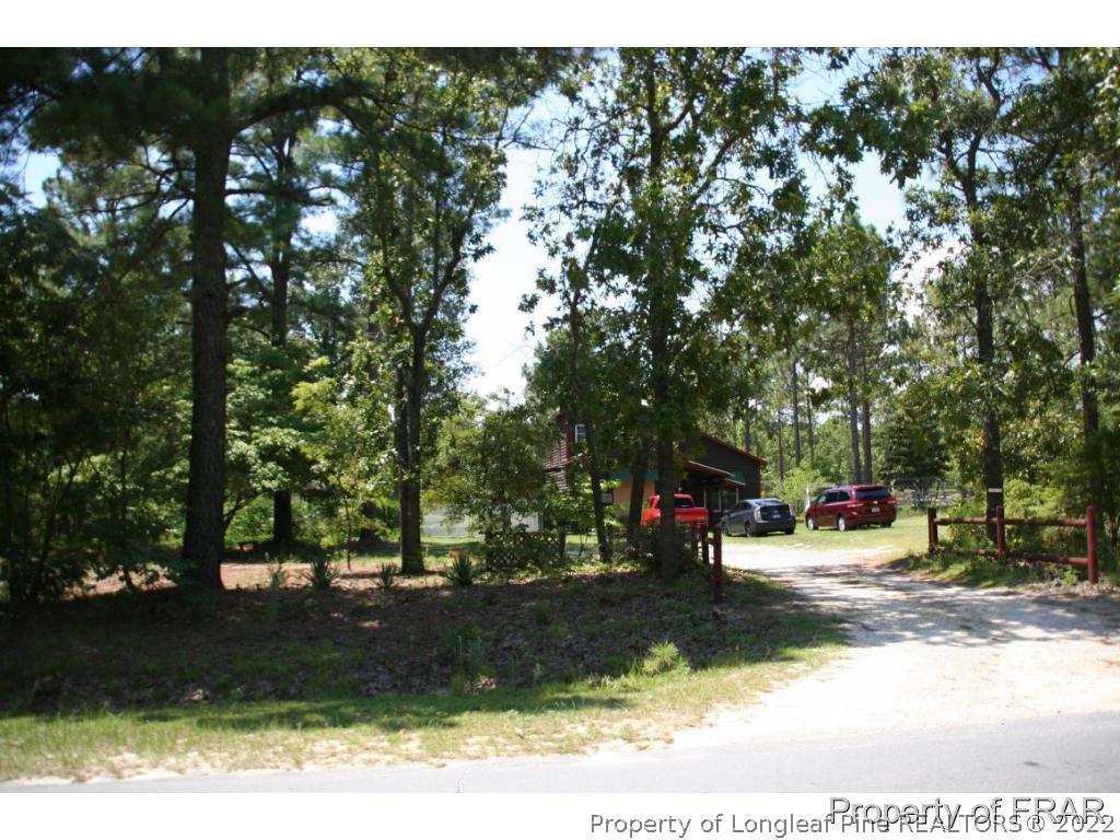 12 West Oaks Road Raeford, NC 28376 - Photo 2 of 8 a view of street with parked cars