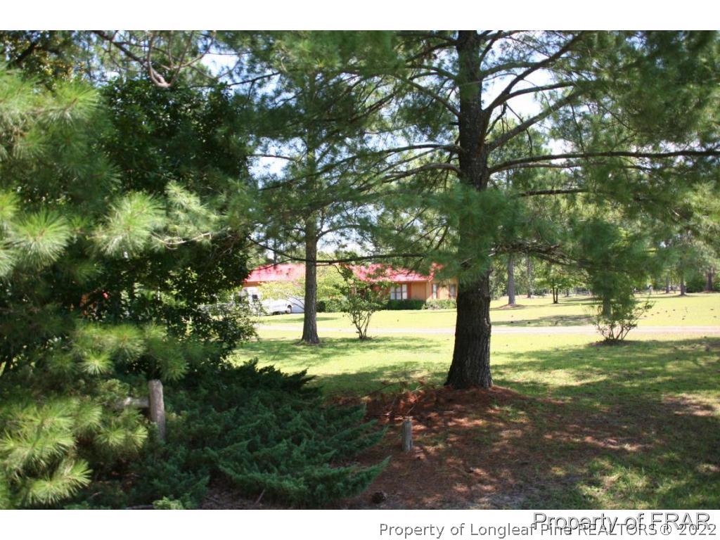 12 West Oaks Road Raeford, NC 28376 - Photo 8 of 8 a view of an outdoor space with a lake view