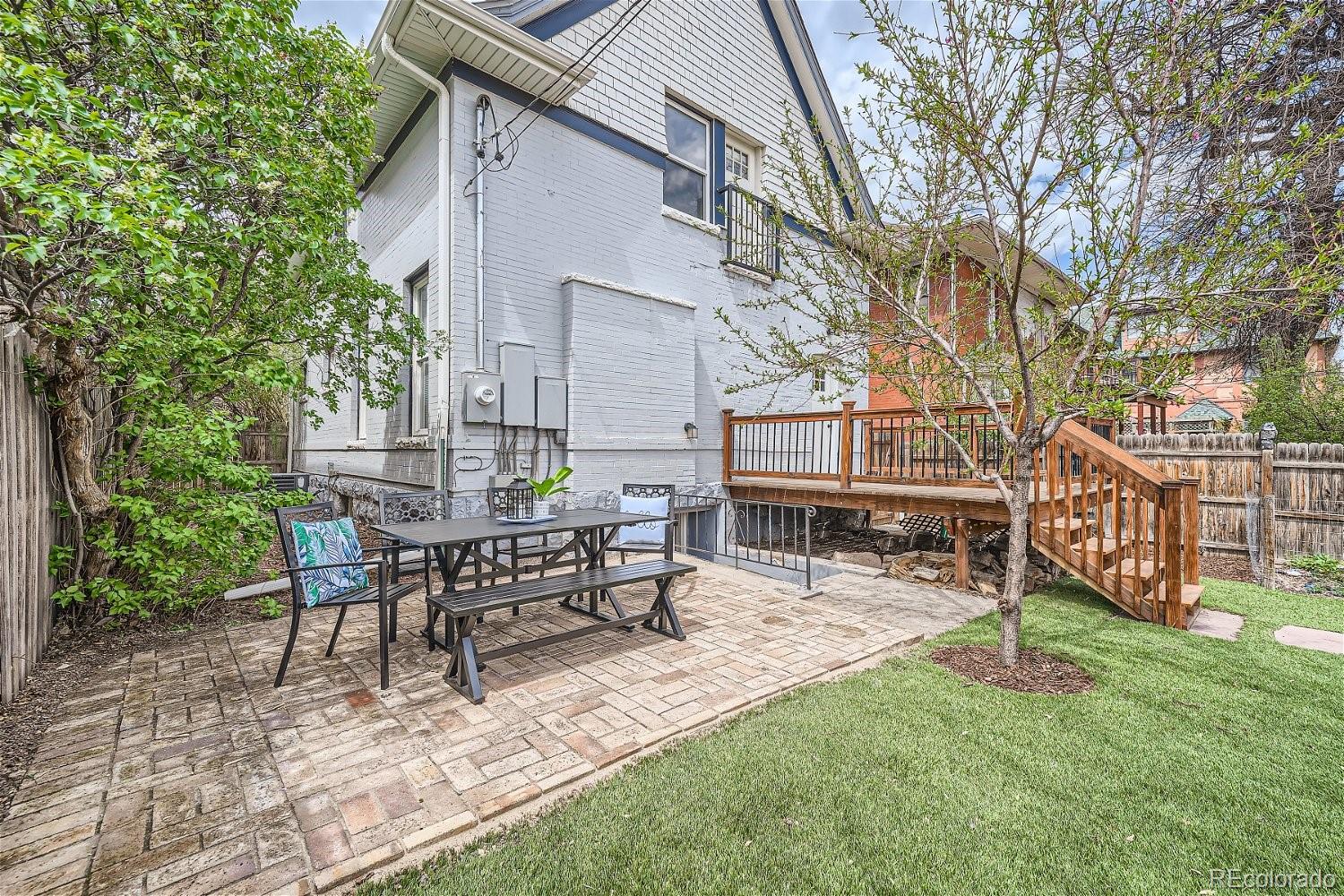 1516 Cook Street Denver, CO 80206 - Photo 27 of 35 a view of a house with backyard and a sitting area