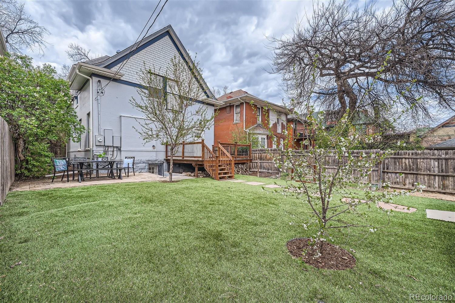 1516 Cook Street Denver, CO 80206 - Photo 5 of 35 a front view of a house with a yard