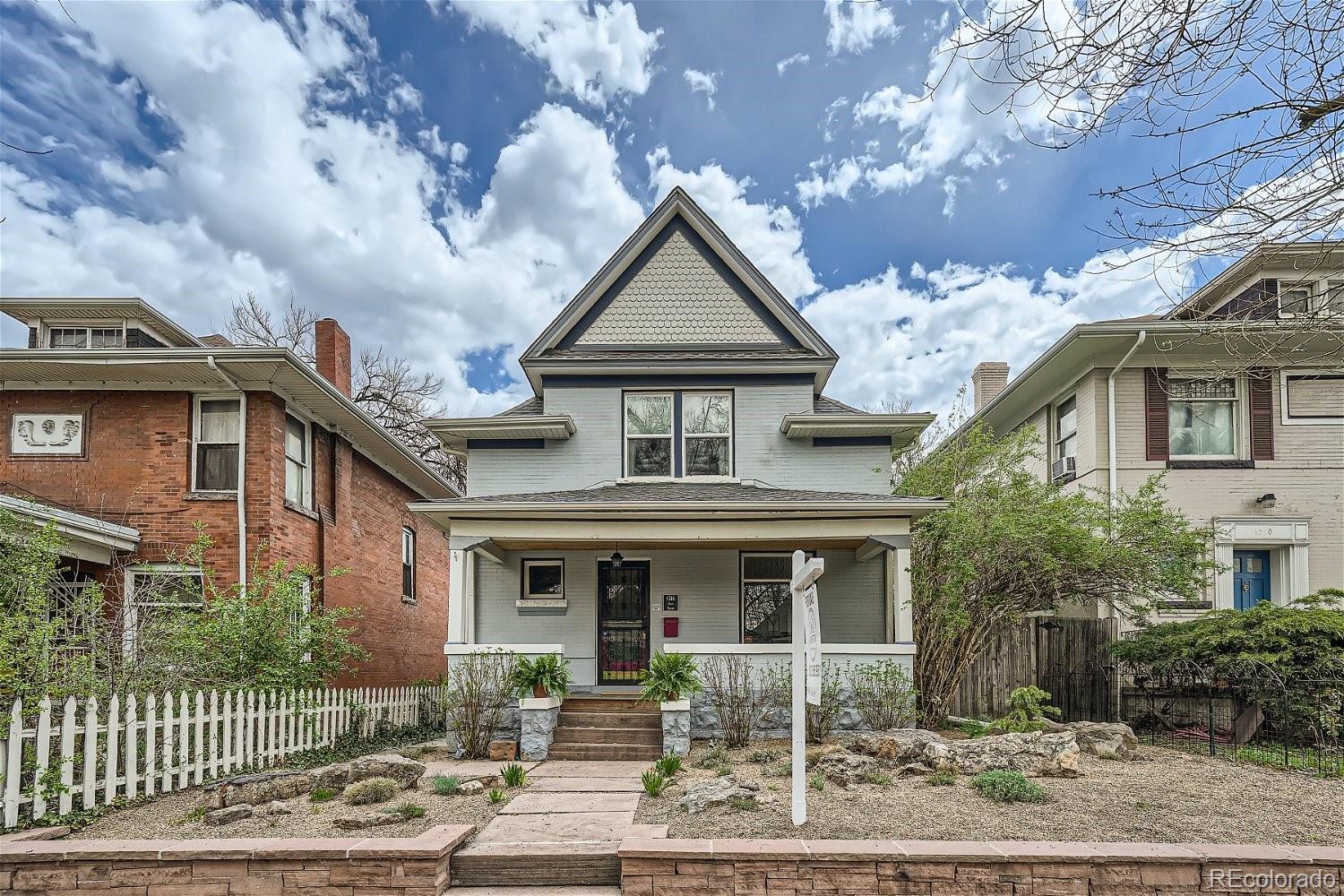 1516 Cook Street Denver, CO 80206 - Photo 7 of 35 a front view of a house with garden