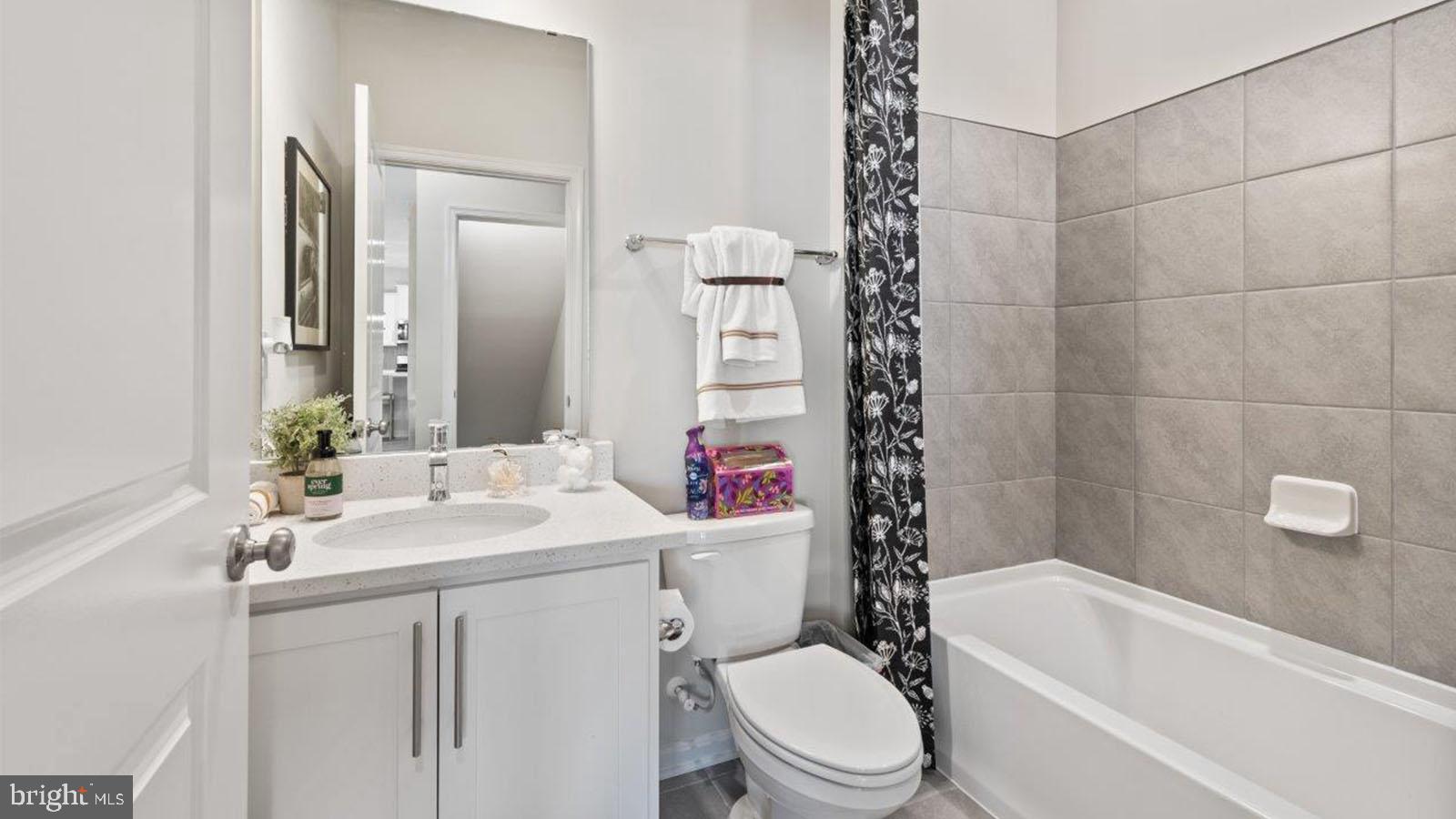 2 Comes Rdg Court Rosedale, MD 21237 - Photo 12 of 29 a bathroom with a sink a toilet and shower