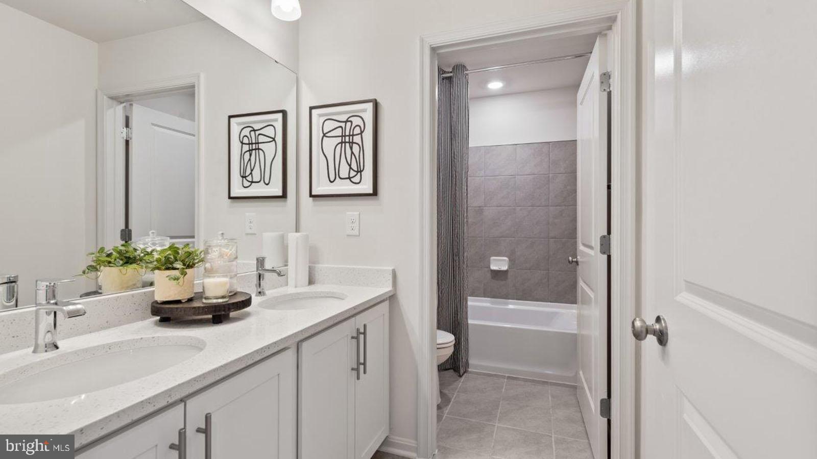 2 Comes Rdg Court Rosedale, MD 21237 - Photo 17 of 29 a bathroom with a sink a toilet and shower