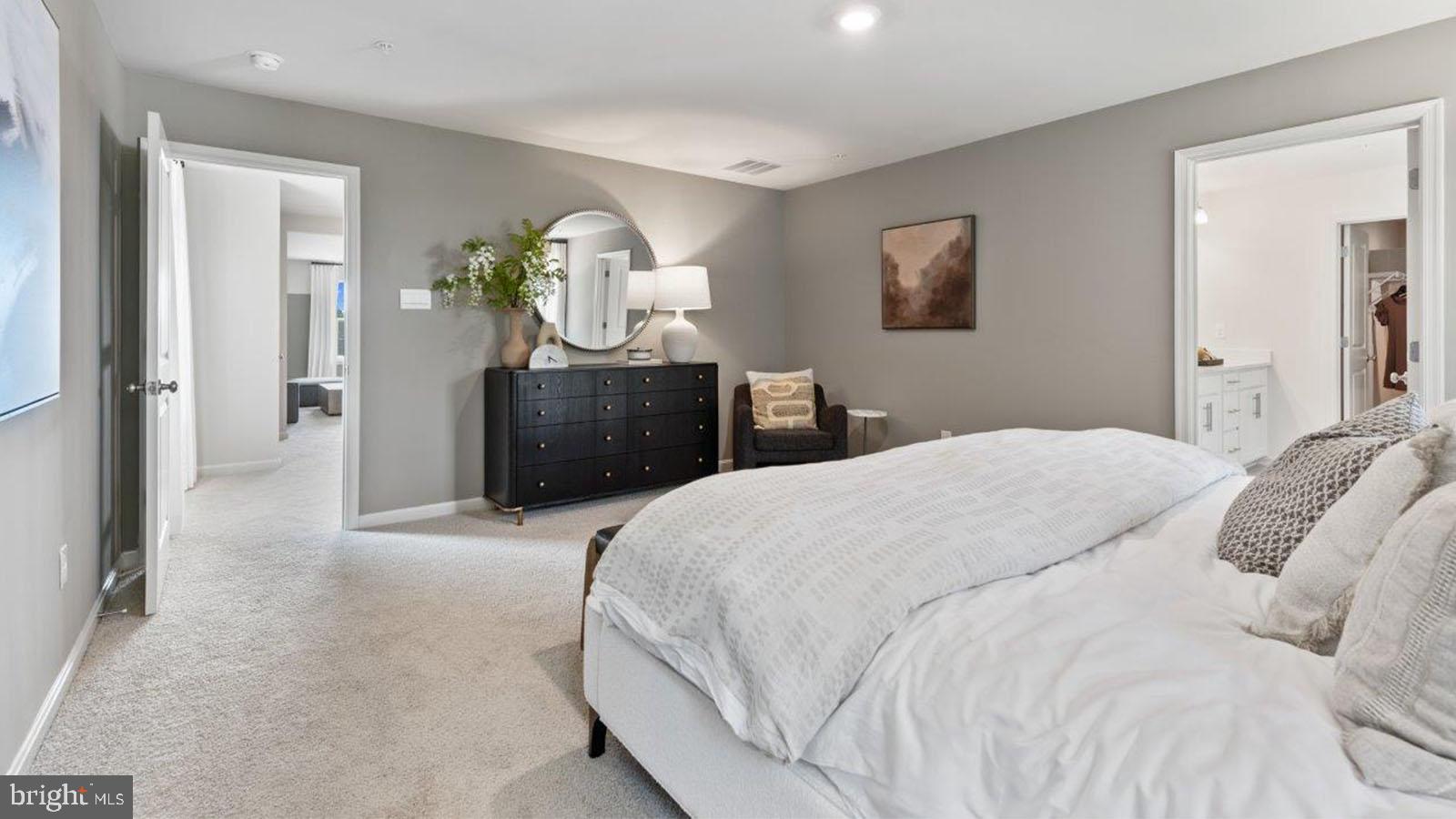 2 Comes Rdg Court Rosedale, MD 21237 - Photo 23 of 29 a bedroom with a bed and painting on the wall