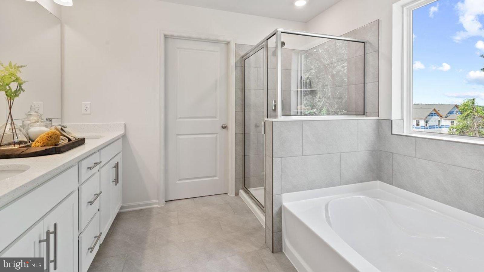 2 Comes Rdg Court Rosedale, MD 21237 - Photo 25 of 29 a bathroom with a tub a sink and a window