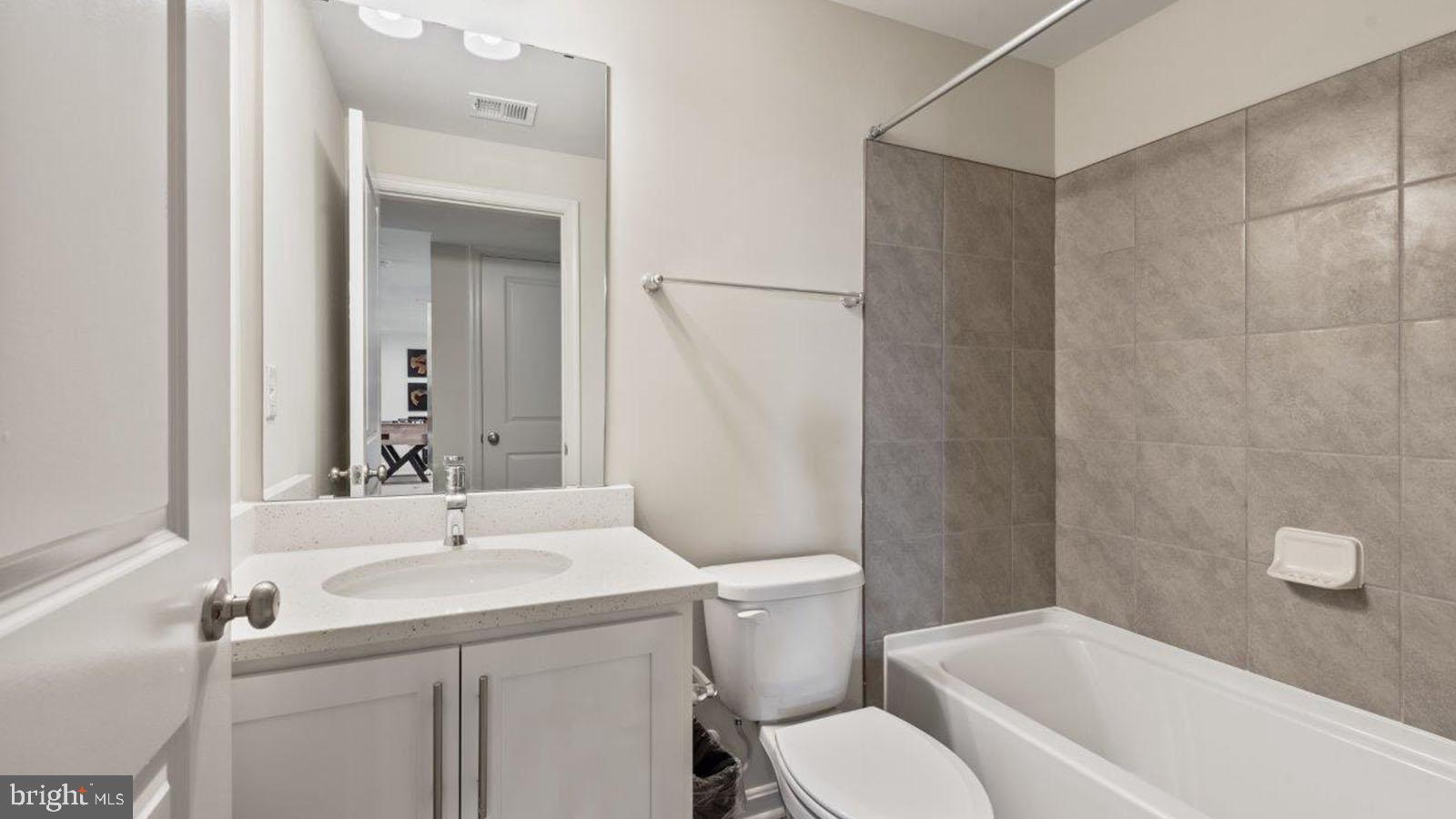 2 Comes Rdg Court Rosedale, MD 21237 - Photo 29 of 29 a bathroom with a sink toilet and shower