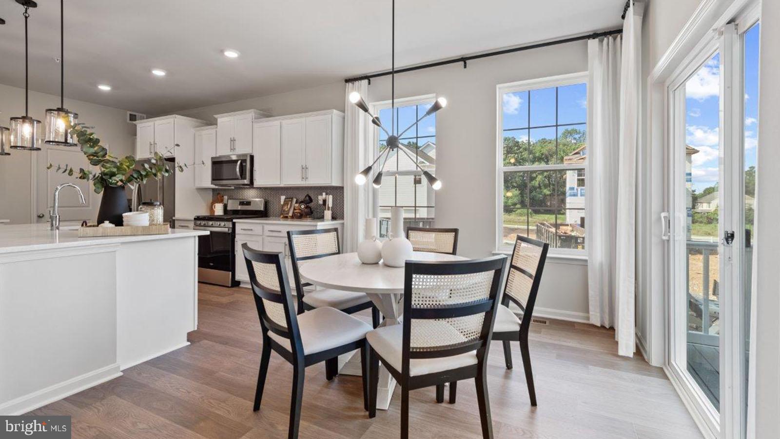 2 Comes Rdg Court Rosedale, MD 21237 - Photo 6 of 29 a dining room with furniture and a chandelier