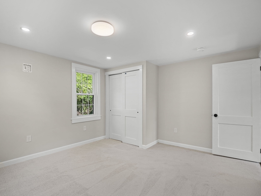210 John Dyer Road Little Compton, RI 02837 - Photo 19 of 42 an empty room with windows and closet