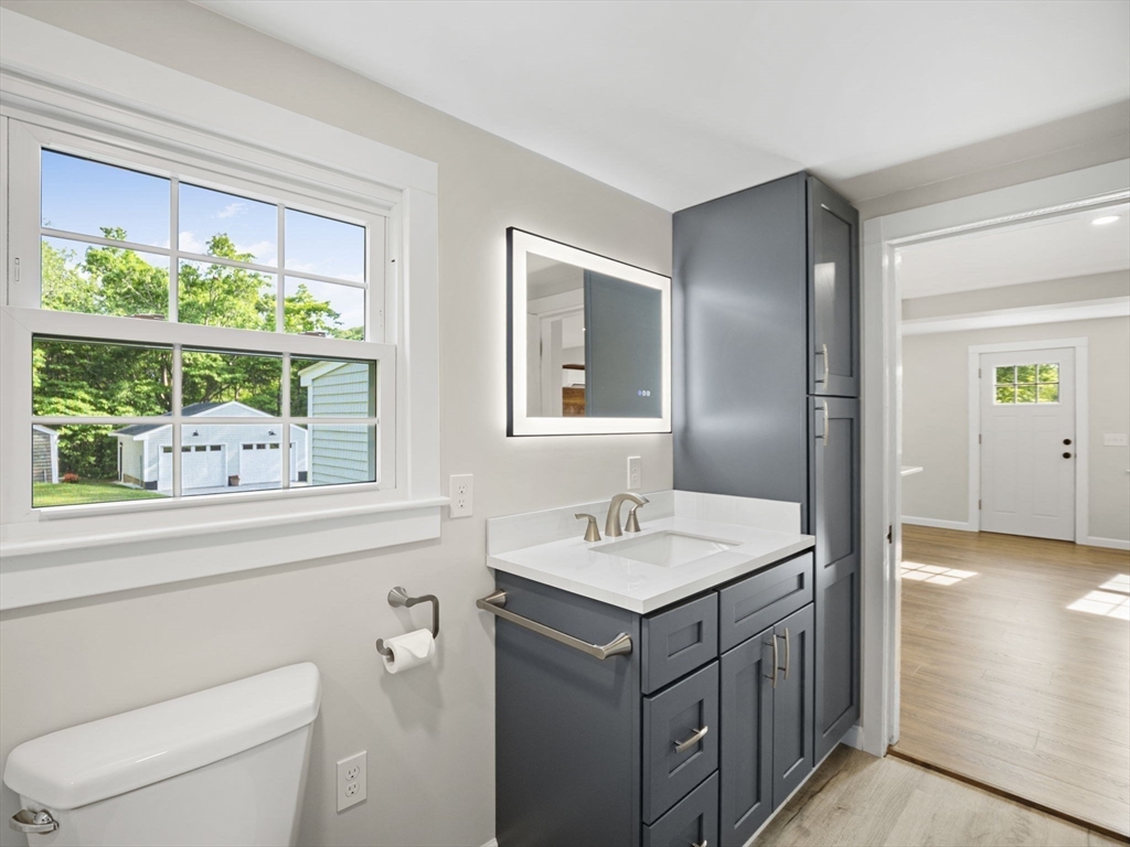 210 John Dyer Road Little Compton, RI 02837 - Photo 22 of 42 a bathroom with a sink a toilet and a window