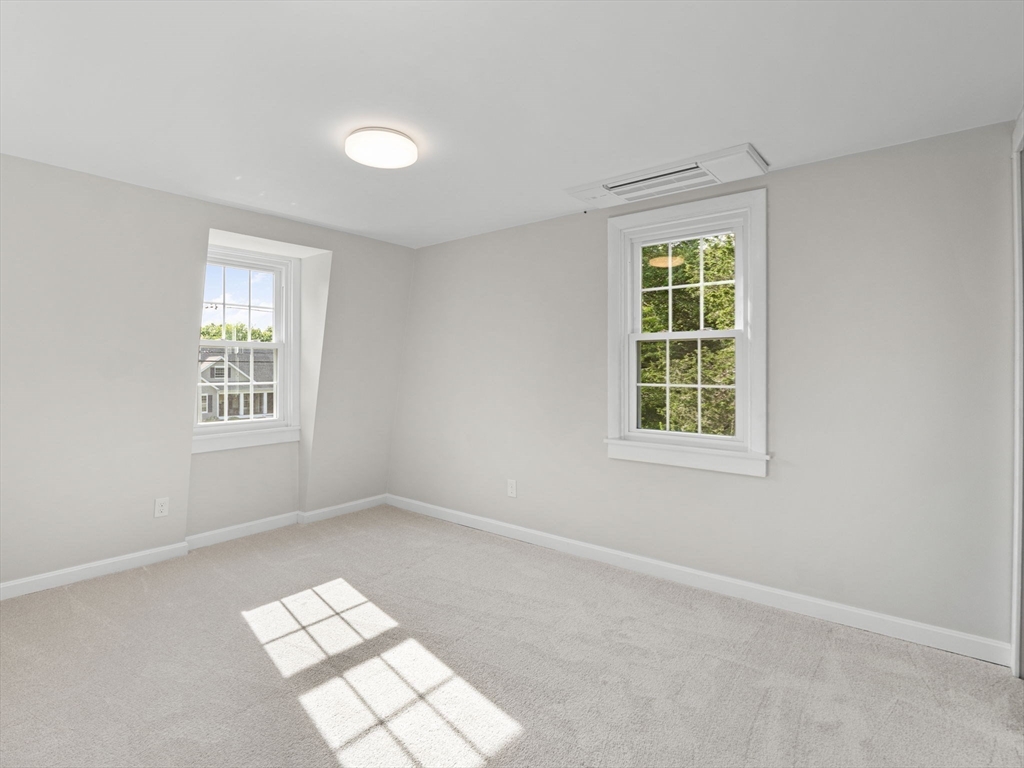 210 John Dyer Road Little Compton, RI 02837 - Photo 23 of 42 an empty room with windows and closet