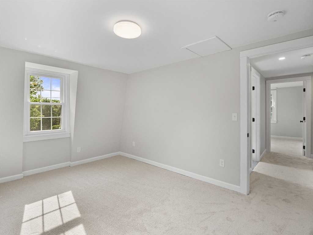 210 John Dyer Road Little Compton, RI 02837 - Photo 29 of 42 a view of an empty room with a window