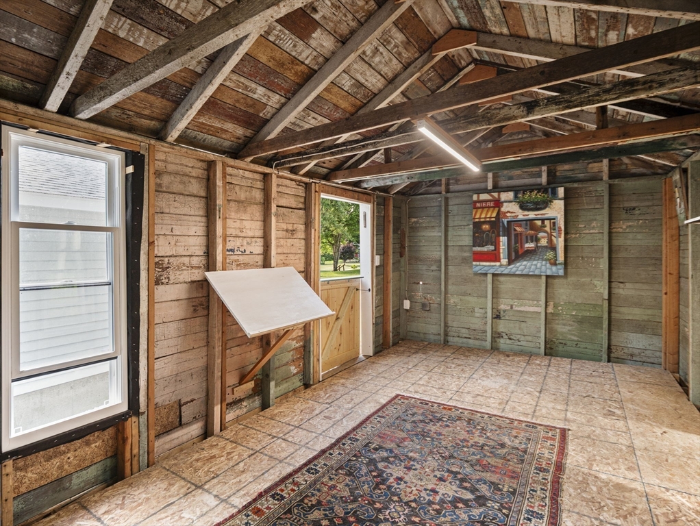 210 John Dyer Road Little Compton, RI 02837 - Photo 34 of 42 a view of a porch with a table and chairs